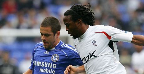 Joe Cole challenges Ricardo Gardner for the ball