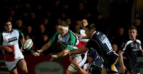 Harlequins lock Jim Evans releases the ball in traffic