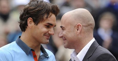 Slam success: Federer is congratulated by Andre Agassi following his French Open win