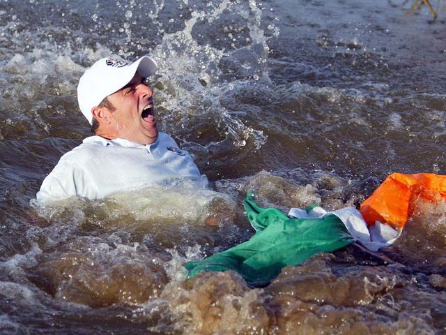 McGinley is thrown into the lake after sinking his crucial putt at the 18th&nbsp;