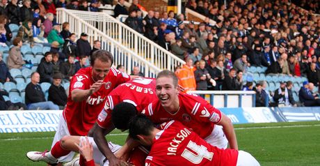 Martin: Mobbed by his team-mates after scoring
