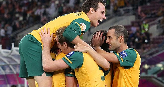 Australia celebrate Kewell's opener