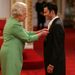 The Queen presents Giggs with an OBE in 2007