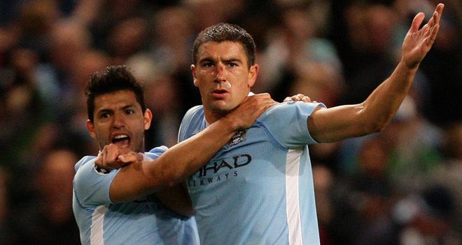 Kolarov is congratulated by Sergio Aguero for his equalising goal