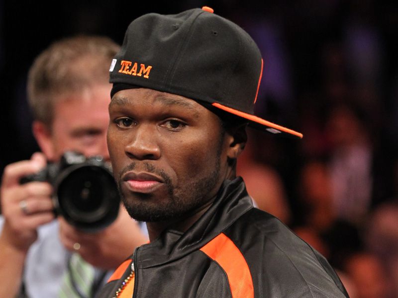 Rapper 50 Cent doesn't look happy like it's his birthday as he finds himself out of Da Club and in the ring before the bout.