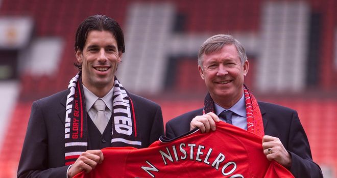 Ruud van Nistelrooy: Poses with Ferguson after signing for United in 2001