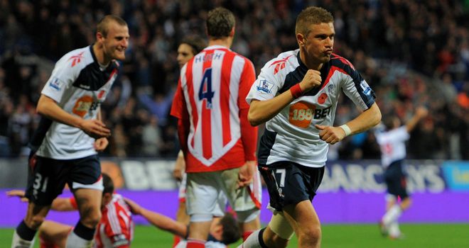 Ivan Klasnic wheels away after heading home Bolton's fifth against Stoke at the Reebok