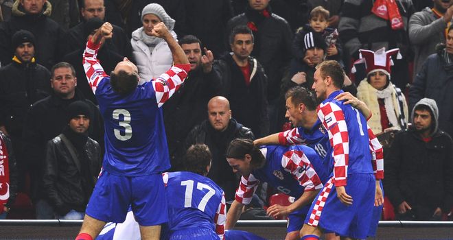 Croatia: Slaven Bilic's men celebrate their emphatic 3-0 first leg win over Turkey