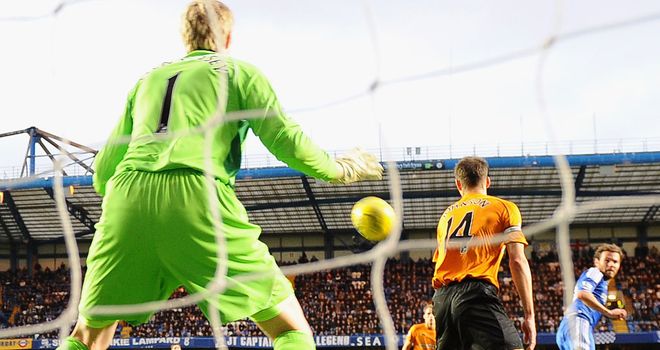 Wayne Hennessey is beaten as Juan Mata makes it 3-0 to Chelsea