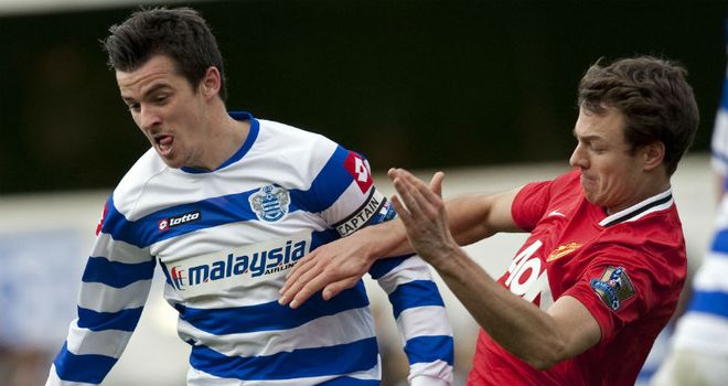 Good battle: Jonny Evans vies with Joey Barton during Manchester United's 2-0 win at QPR