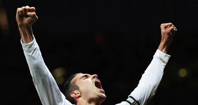 Robin van Persie celebrates his winning goal against QPR