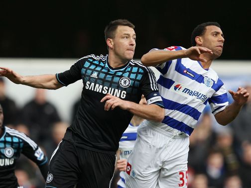 John Terry and Anton Ferdinand vie for the ball