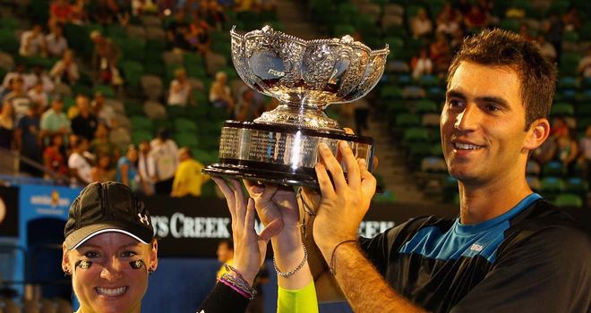 Bethanie Mattek-Sands and Horia Tecau celebrate their victory.
