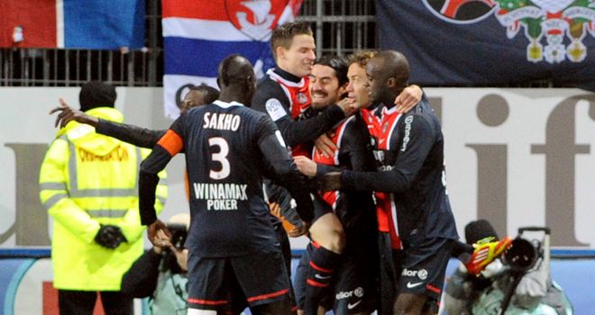 Milan Bisevac is mobbed by his PSG team-mates after scoring against Brest