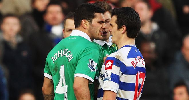 Joey Barton saw red after this tussle with Bradley Johnson in Norwich's 2-1 win at QPR