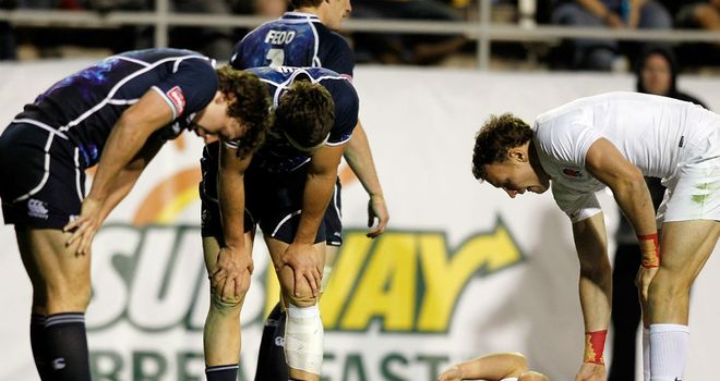 Scotland are left dejected after Christian Lewis-Pratt (on his back) scores the winner