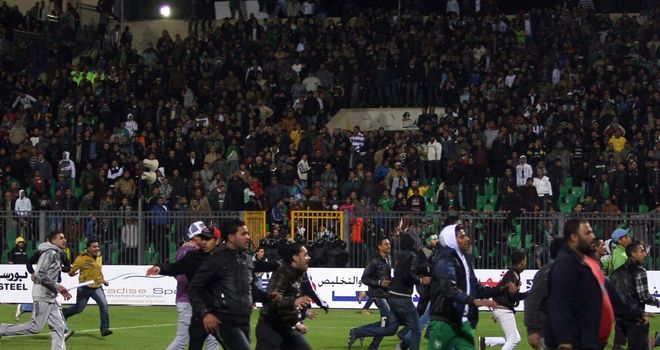 Fans invaded the pitch after the Egyptian league match between Al-Masry and Al-Ahly