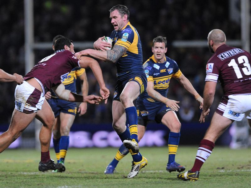 Jamie Peacock attempts to carry the ball clear as Leeds are pinned back inside their own half.
