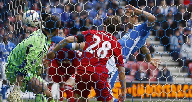 James McArthur pokes the ball home to give Wigan the lead
