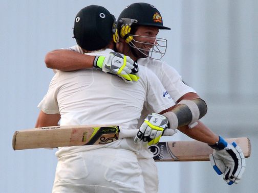 Harris and Hilfenhaus celebrate the winning run