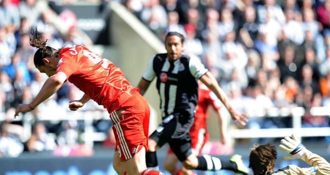 Andy Carroll goes to ground having taken the ball past Tim Krul