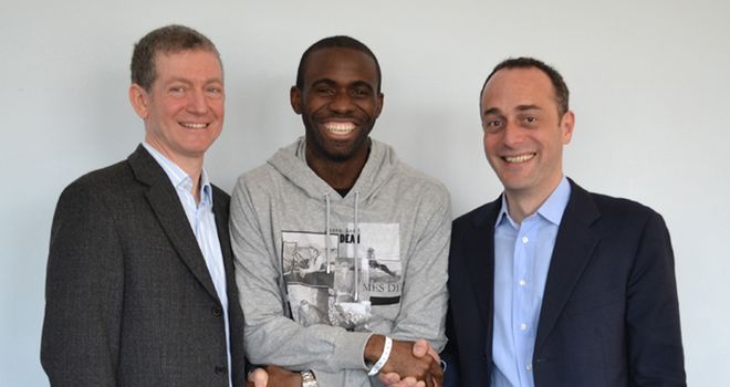 Discharged: Muamba with Dr Andrew Deaner and Dr Sam Mohiddin of Barts Health NHS Trust (Credit: Twitter @OfficialBWFC)