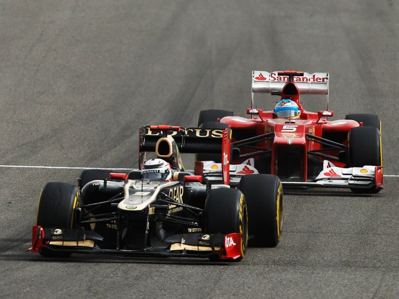 Kimi Raikkonen leads Fernando Alonso