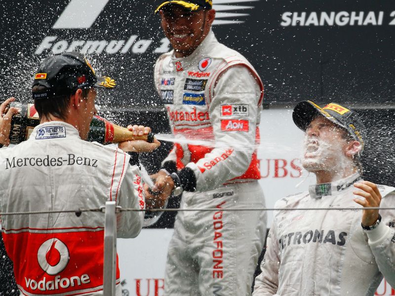The McLaren boys spray Rosberg with bubbly