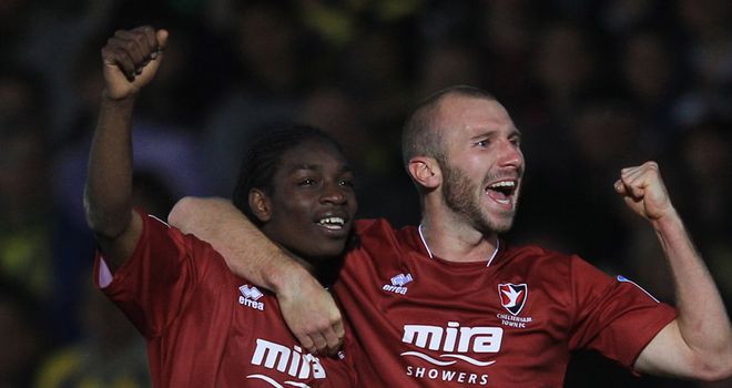 Jermaine McGlashan celebrates scoring the opening goal of the night at Plainmoor