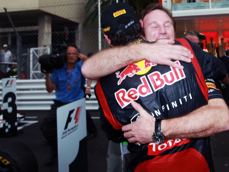 Mark Webber is congratulated by Christian Horner