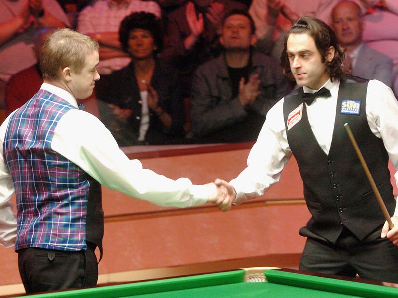 A new rival: Ronnie O'Sullivan gives Hendry the eyes in 2004