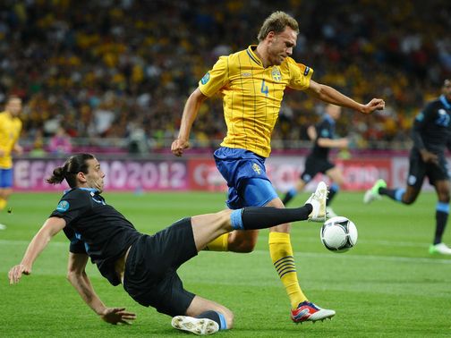 Carroll bids to win the ball from Granqvist.