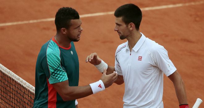 Epic encounter: Jo-Wilfried Tsonga (left) and Novak Djokovic