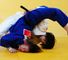 Kelly Edwards is put in an awkward position by Tomoko Fukumi in judo.