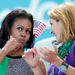 First lady of the USA, Michelle Obama talks to 1992 Barcelona 200m butterfly gold medalist Summer Sanders.