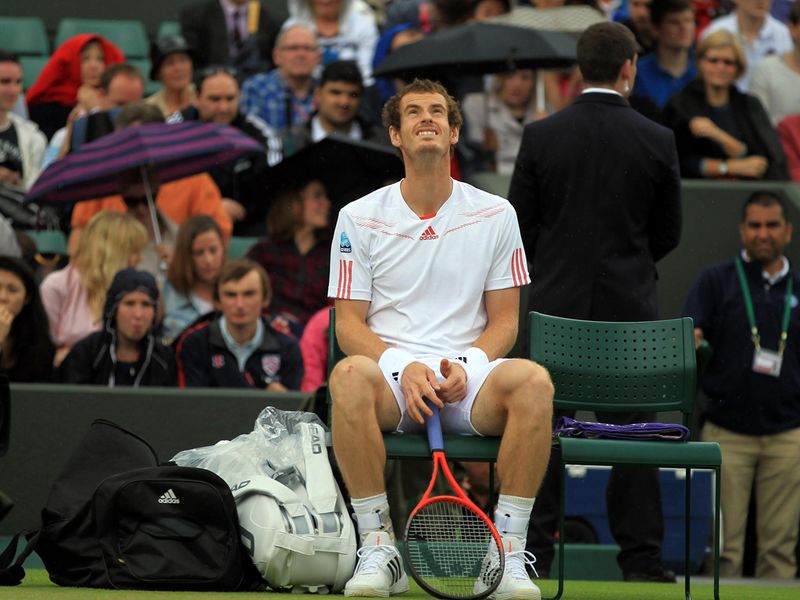 Andy Murray looked as though he was going to be hampered by rain once again.
