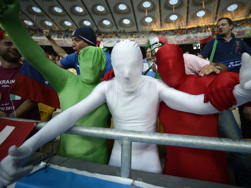 Flying the flag, or rather wearing it... Italian fans have flooded into Kiev&#39;s Olympic Stadium as they prepare for Spain vs Italy in the Euro 2012 final.