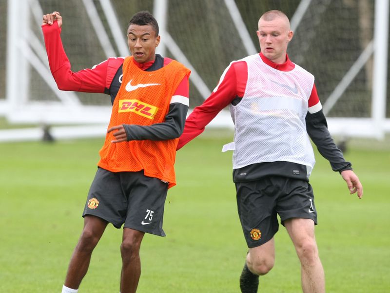 Jesse Lingard and Ryan Tunnicliffe in action