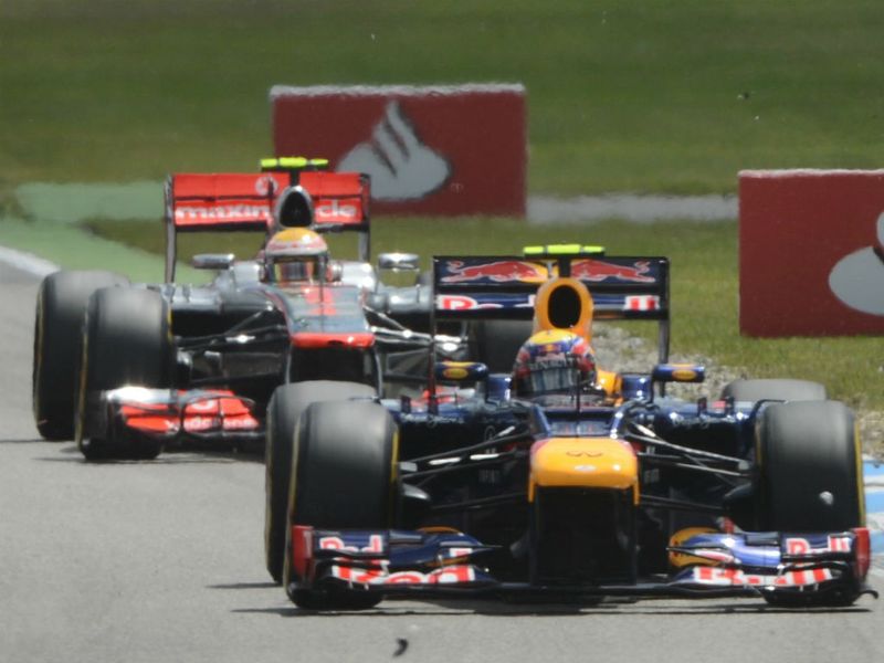 Mark Webber with Lewis Hamilton on his tail
