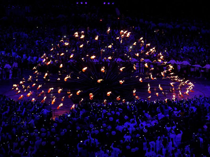 A spectacular Opening Ceremony came to a fitting end, as seven young athletes were handed the responsibility of lighting the Olympic Cauldron