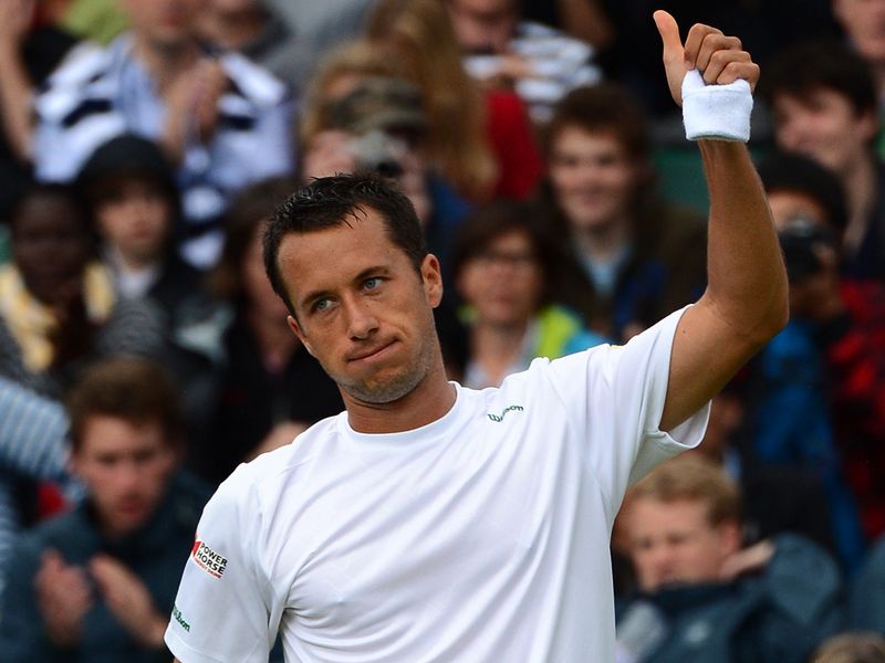 German Philipp Kohlschreiber halted Brian Baker's remarkable 12-month journey with victory at Wimbledon.
