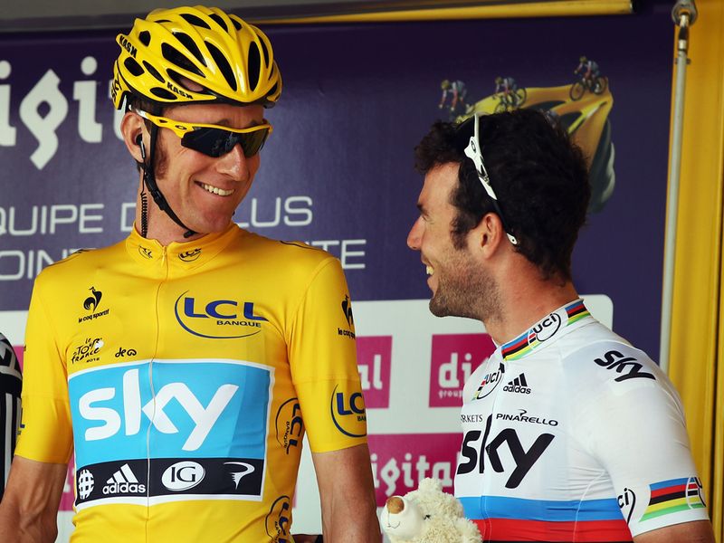 Bradley Wiggins and Mark Cavendish share a smile at the start of the day