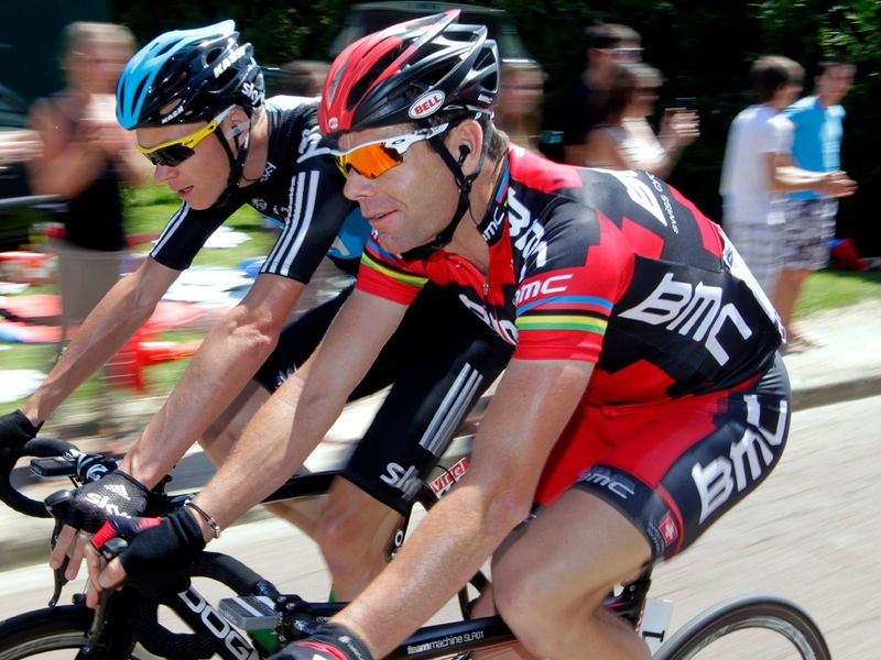 Outgoing champion Cadel Evans chats to Chris Froome