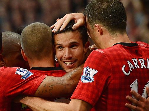 Van Persie celebrates scoring on his first United start