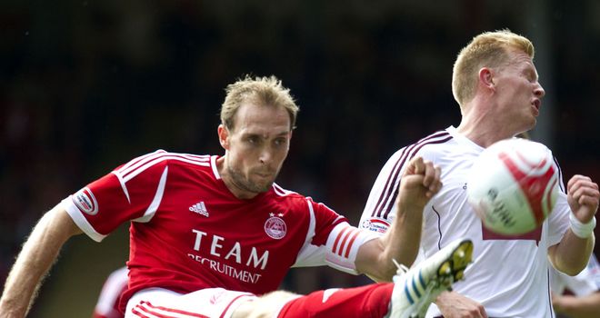 Anderson: Knocks the ball away from Driver