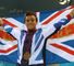 Tom Daley celebrates his bronze medal