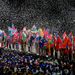 Athletes from all 204 nations flood into the stadium simultaneously