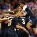 Daniel Sturridge is mobbed after scoring the only goal of the game against Uruguay, sending GB through to the last eight.