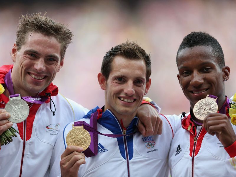 Frenchman Renaud Lavillenie picks up the Gold medal following his performance in last night's Men's Pole Vault Final.