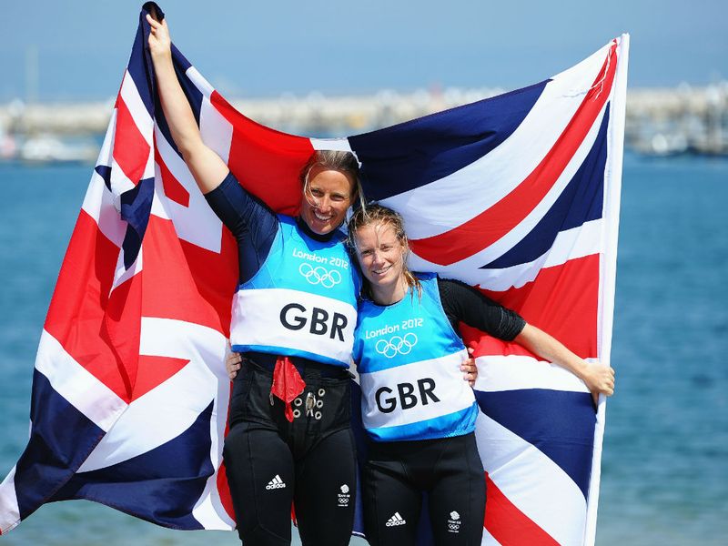 Brits Hannah Mills and Saskia Clark celebrate after taking the silver medal in the 470 class at Weymouth.